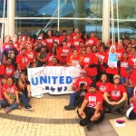 United Airlines catering workers pose at the Denver Airport